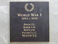Square bronze plaque with list of names in gold under picture of a laurel wreath and heading World War 1 1914-1918