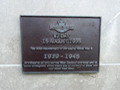 Bronze plaque with text under heading VJ Day 15 August 1995