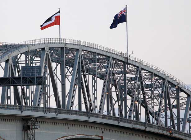 Tino Rangatiratanga flag flying on Auckland Harbour Bridge
