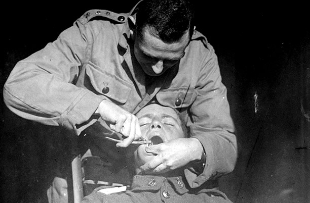 New Zealand soldier undergoing a dental extraction at the New Zealand Dental Corps hospital in Nielles, France