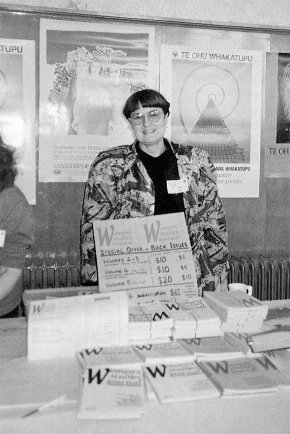 Anne Else behind a books stand selling WSA journals