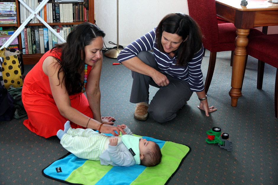 La Leche League leader with mother and child