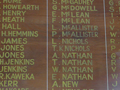 Detail of wooden plaque with list of names in gold lettering.