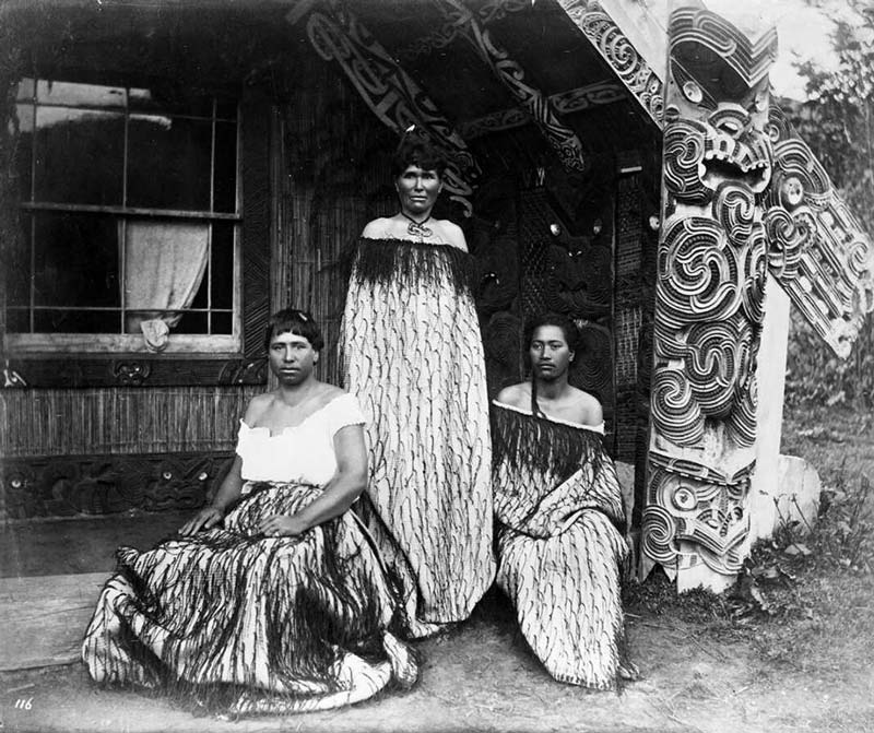 Group of guides in front of whare