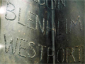 Detail of text on column featuring the words Blenheim, Westport and Greymouth