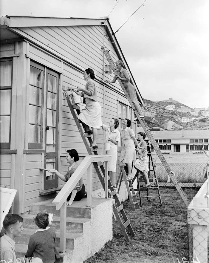 Women working on ladder