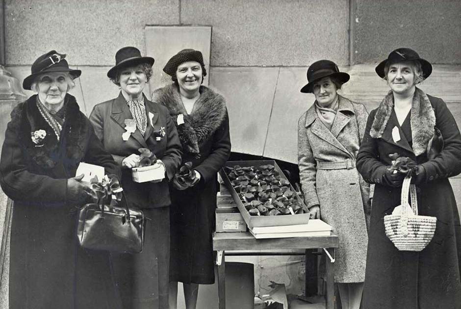Women selling Anzac poppies