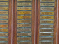 View of wooden roll of honour board with names inscribed on brass plaques