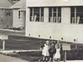 Kids playing outside art deco house