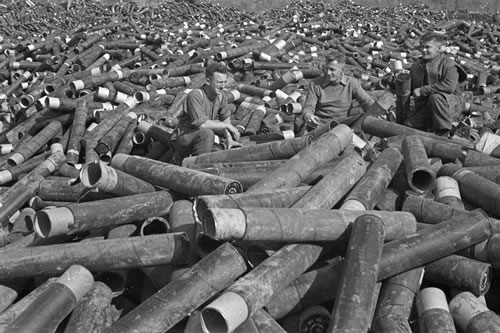 Soldiers among piles of empty shells