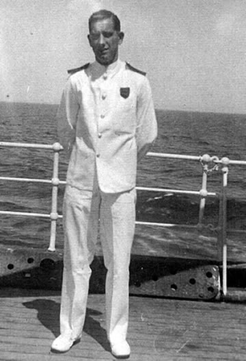 Les Watson posing for a photo on a ship's deck