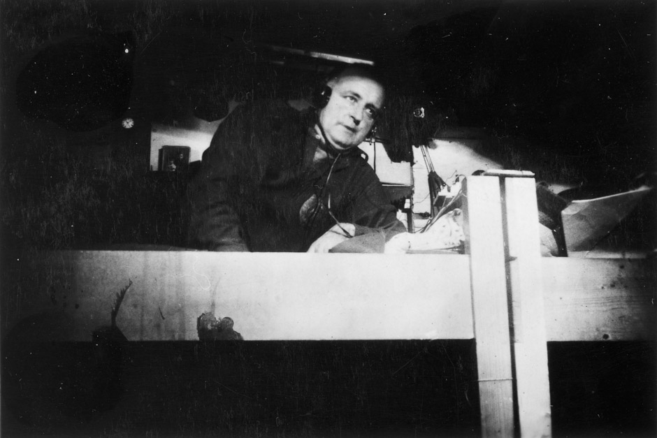 man in bunk listening to radio