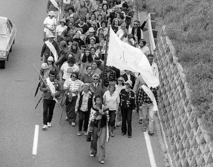 Cropped image of 1970 hīkoi protesters walk past Porirua on their way to Parliament in Wellington