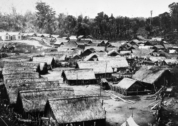 Black and white photograph of whare (buildings) in Parihaka village taken in the 1880s.
