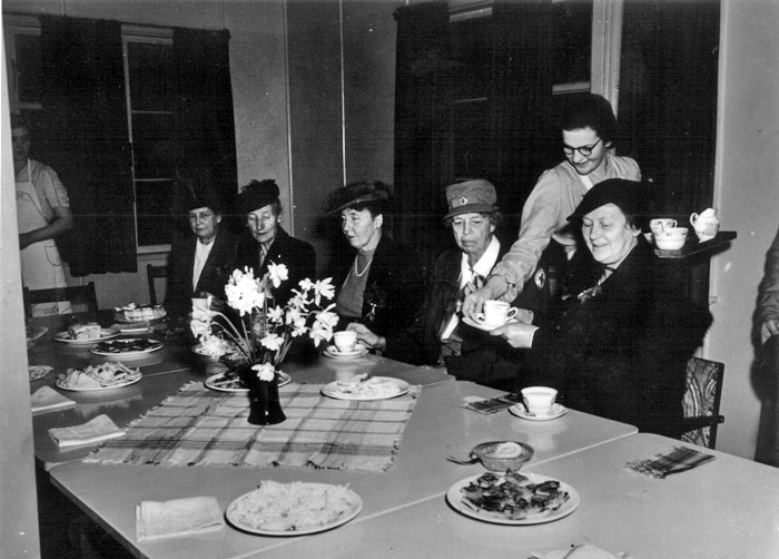 Eleanor Roosevelt having afternoon tea at YMCA hostel