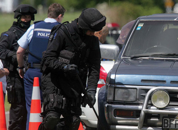 Armed police search a vehicle near Rūātoki