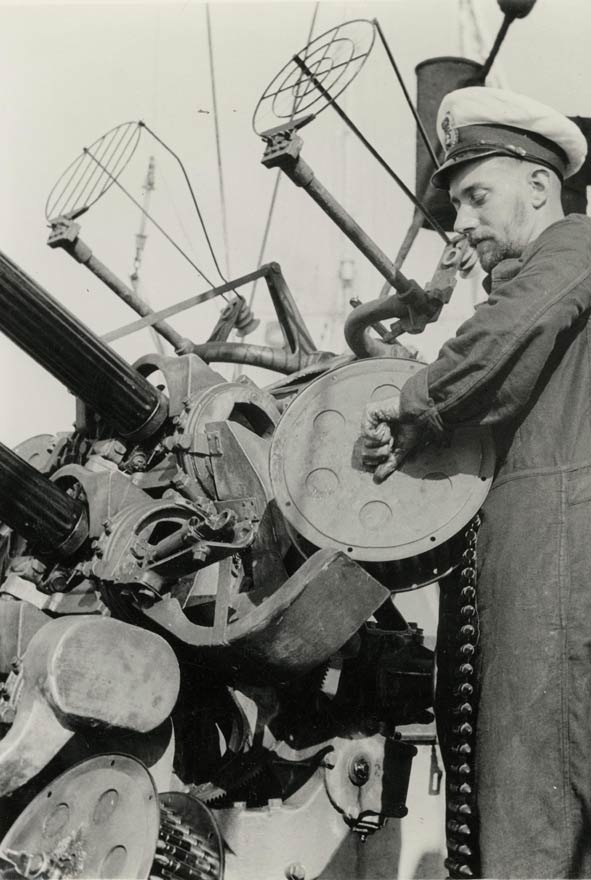 Loading anti-aircraft guns during war in the Pacific 