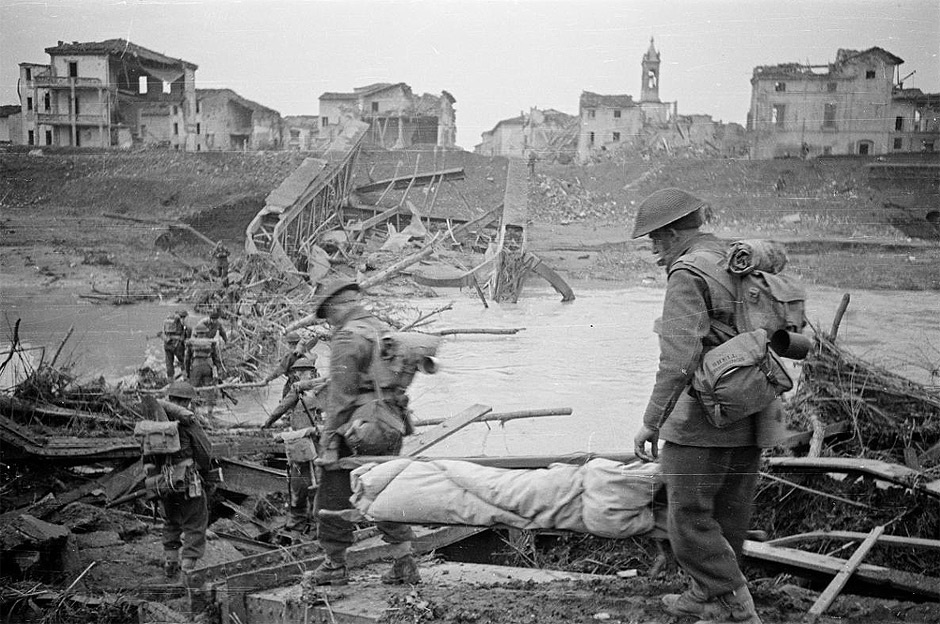 NZ soldiers crossing destroyed Italian bridge