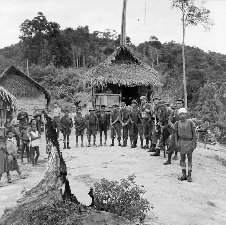 Members of  1 NZ Regiment on patrol in Malaya