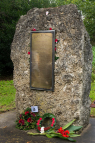 View brass plaque with list of names inlaid into a piece of rock
