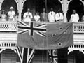Raising the New Zealand flag in Apia, 1930s