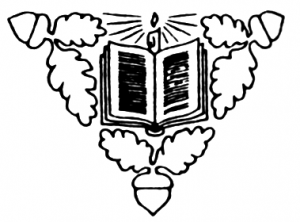 An acorn decoration around an open book