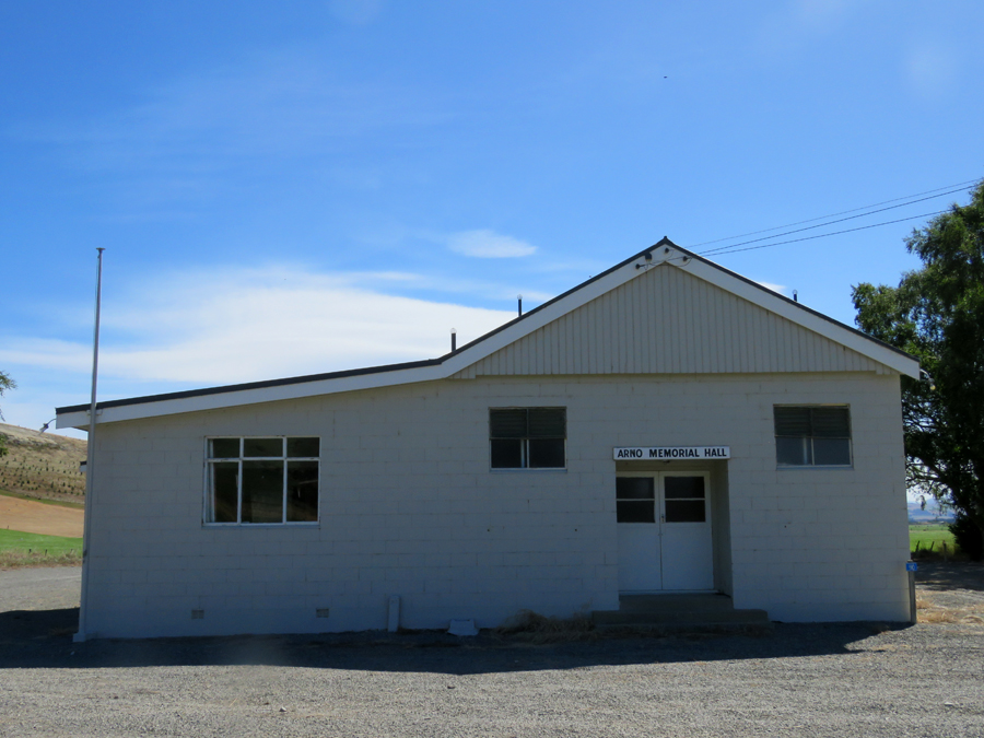 Wooden hall with gravel carpark