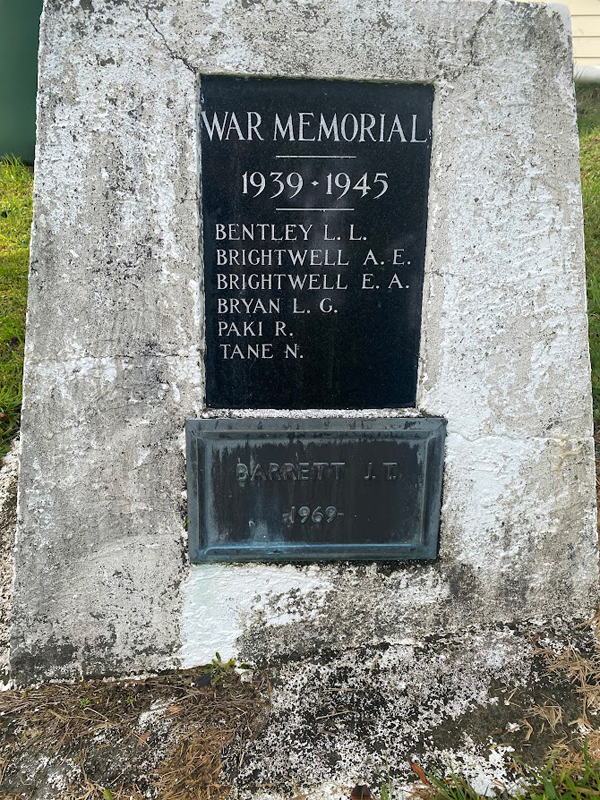 Stone obelisk with two inlaid plaques with list of names