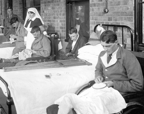 Returned servicemen embroidering in hospital