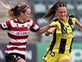 A women in a yellow uniform shown during a football game contesting the ball against a player in a striped red and white uniform.