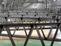 Crossed metal support structure under the bridge