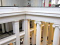 View from third floor looking down on Roman columns and across to walls covered in names