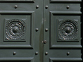 Large solid green doors   - entry point to bank from pavement