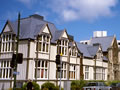 Group of historic buildings on modern street