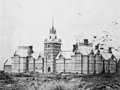 Group of historic buildings in a paddock