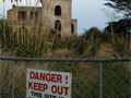 Site of ruins of castle with 'Danger Keep Out!' sign