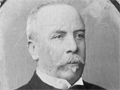White-haired man with moustache and chin tuft
