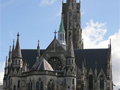 Large church from outside with grand spires and windows