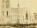 Historical image of church under construction on bare site