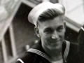 Young man in navy uniform on ship