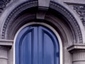 Blue wooden door and arched doorway