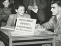 Official and couple at desk