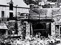 Historic image of men working at entrance to tunnel