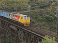 Train going over metal viaduct