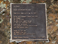 Plaque on wall with poem by Peter Deans Ritchie about walking up the Old Coach Road