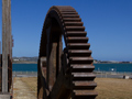 Information panel with title 'The engine house' next to a large steel grinding wheel