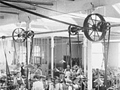 Women working inside crowded factory