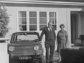 Couple in front of house
