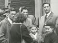 Queue of people on street