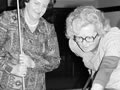 two women playing pool